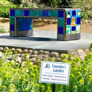 A bench with blue and green tiles on it