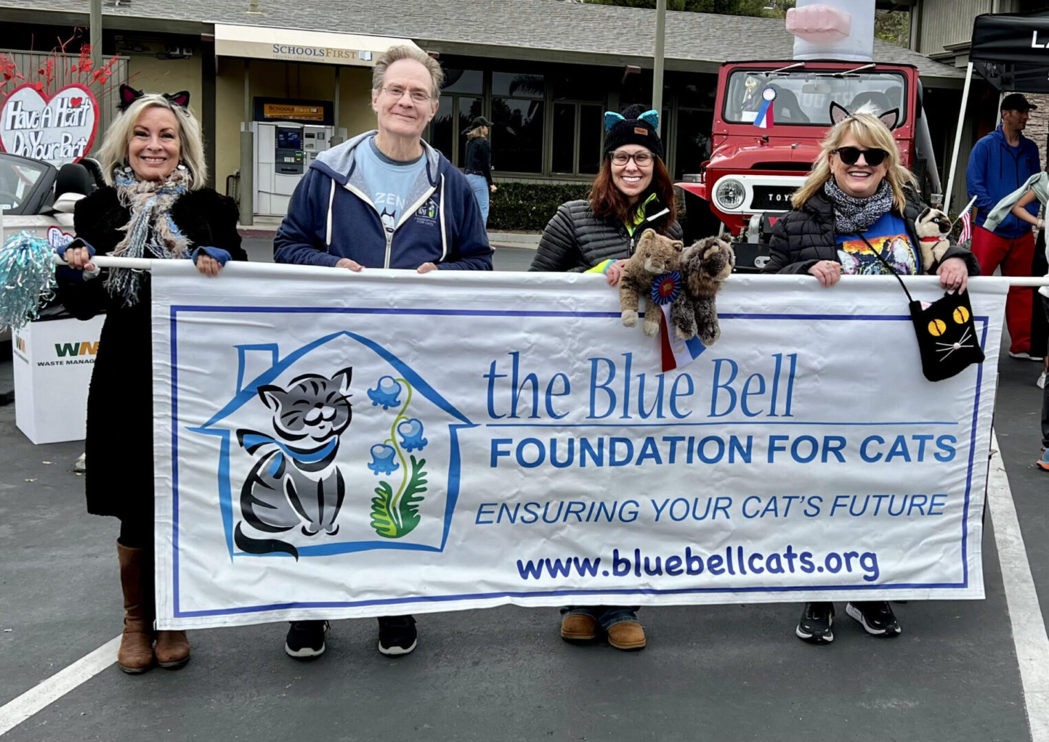 A group of people holding a banner